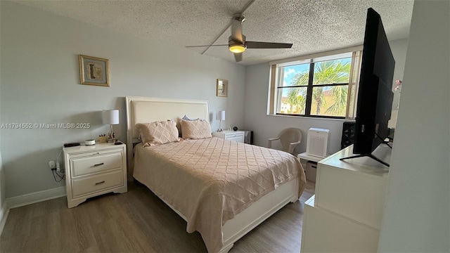 bedroom featuring a textured ceiling and wood finished floors