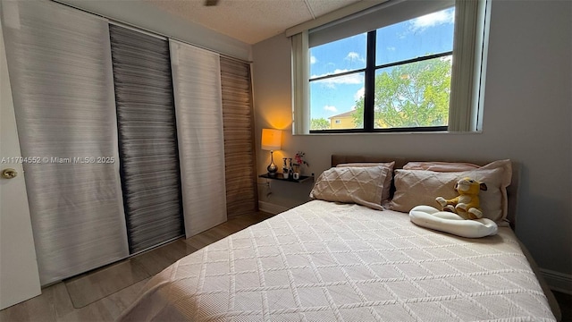 bedroom featuring wood finished floors
