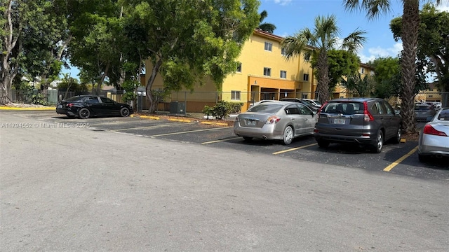 uncovered parking lot with fence