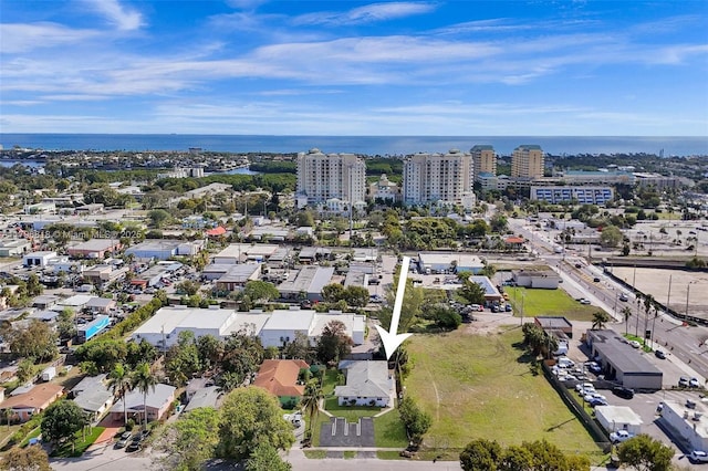 aerial view featuring a city view and a water view