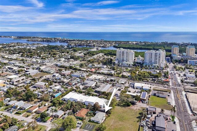 bird's eye view featuring a water view and a view of city