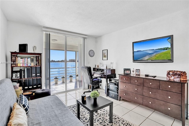1000 NE 191st St Unit 21, Miami, FL 33179 - living area featuring light tile patterned flooring and a textured ceiling