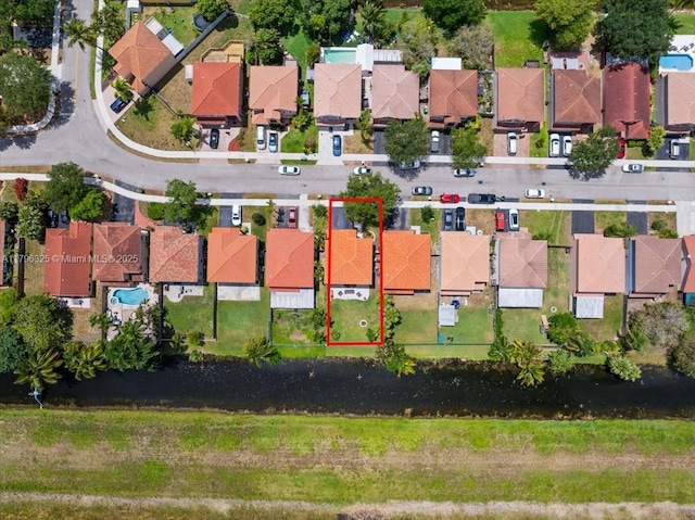 birds eye view of property with a residential view