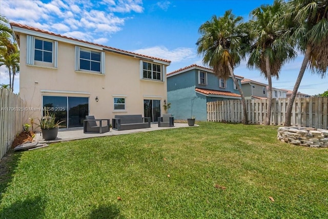 4370 SW 82nd Way, Davie, FL 33328 - rear view of house featuring a yard, a patio area, stucco siding, and a tile roof
