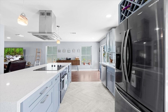 4370 SW 82nd Way, Davie, FL 33328 - kitchen featuring appliances with stainless steel finishes, island range hood, healthy amount of natural light, open floor plan, and recessed lighting