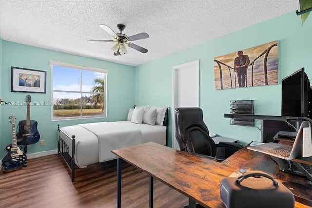 4370 SW 82nd Way, Davie, FL 33328 - bedroom with wood finished floors, an office area, a textured ceiling, baseboards, and ceiling fan