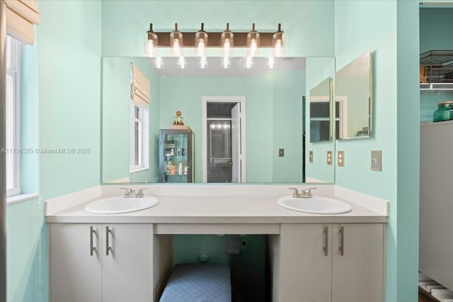 bathroom with double vanity and a sink