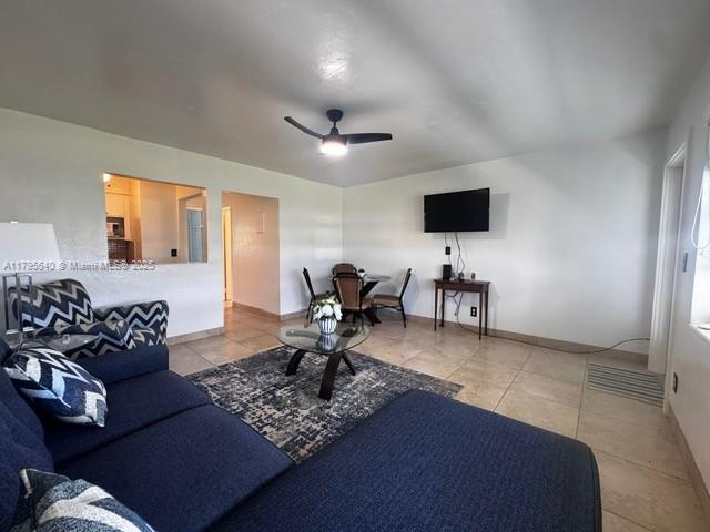 801 Atlantic Shores Blvd Unit 115, Hallandale Beach, FL 33009 - living area with visible vents, tile patterned flooring, baseboards, and ceiling fan