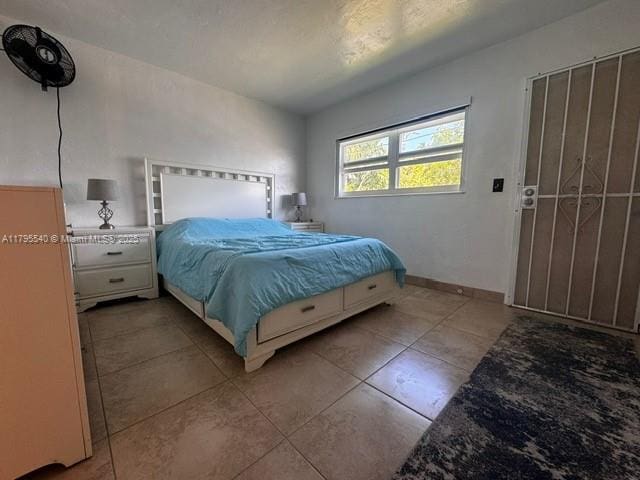 801 Atlantic Shores Blvd Unit 115, Hallandale Beach, FL 33009 - bedroom with tile patterned flooring and baseboards