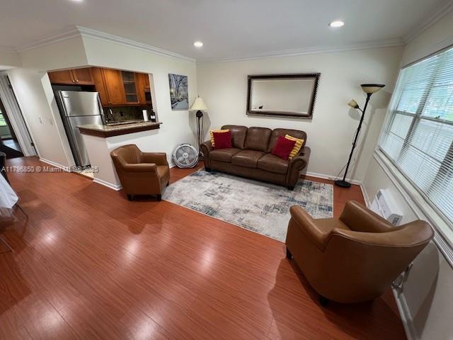 14 Westbury A 14, Deerfield Beach, FL 33442 - living room featuring baseboards, recessed lighting, crown molding, and dark wood-type flooring