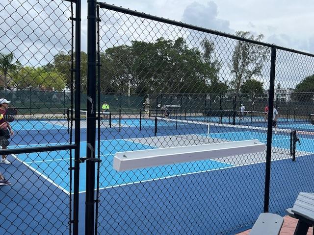 14 Westbury A 14, Deerfield Beach, FL 33442 - view of tennis court with fence