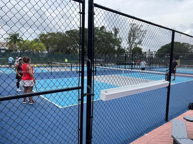 14 Westbury A 14, Deerfield Beach, FL 33442 - view of sport court featuring fence