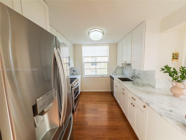 520 SE 5th Ave Unit 3302, Fort Lauderdale, FL 33301 - kitchen featuring white cabinets, dark wood finished floors, stainless steel appliances, and a sink