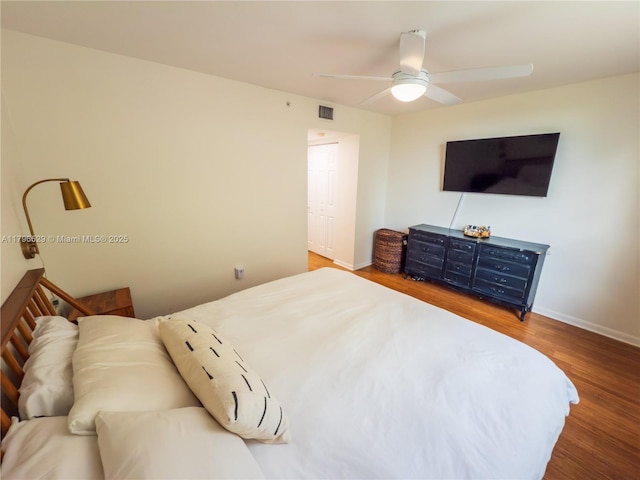 520 SE 5th Ave Unit 3302, Fort Lauderdale, FL 33301 - bedroom with baseboards, ceiling fan, visible vents, and wood finished floors