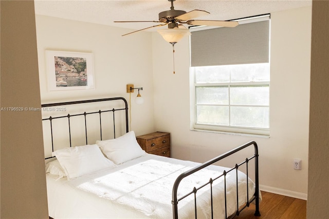 520 SE 5th Ave Unit 3302, Fort Lauderdale, FL 33301 - bedroom featuring ceiling fan, baseboards, and wood finished floors