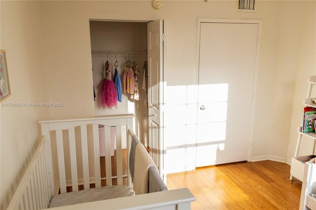 520 SE 5th Ave Unit 3302, Fort Lauderdale, FL 33301 - bedroom featuring a closet, visible vents, and wood finished floors