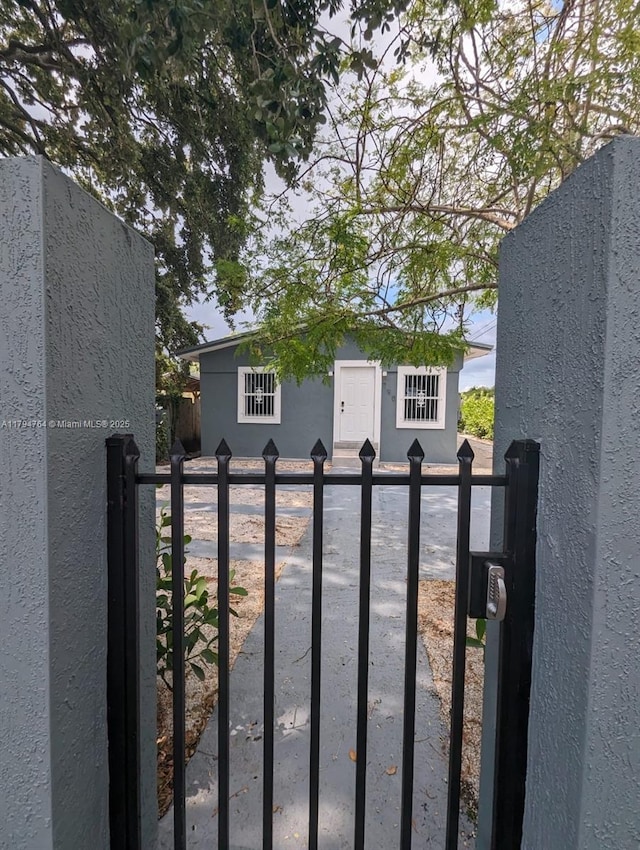 view of gate featuring fence