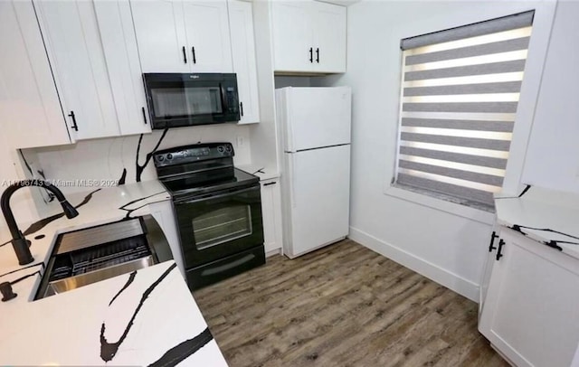 3688 N University Dr Unit H-3, Coral Springs, FL 33065 - kitchen featuring light countertops, white cabinetry, wood finished floors, and black appliances