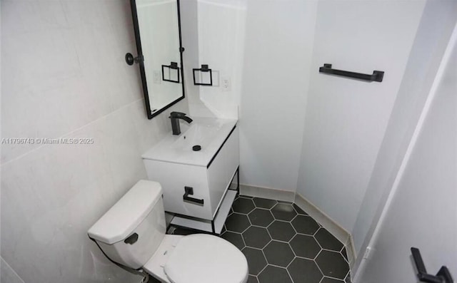 3688 N University Dr Unit H-3, Coral Springs, FL 33065 - bathroom featuring toilet, tile patterned flooring, and vanity
