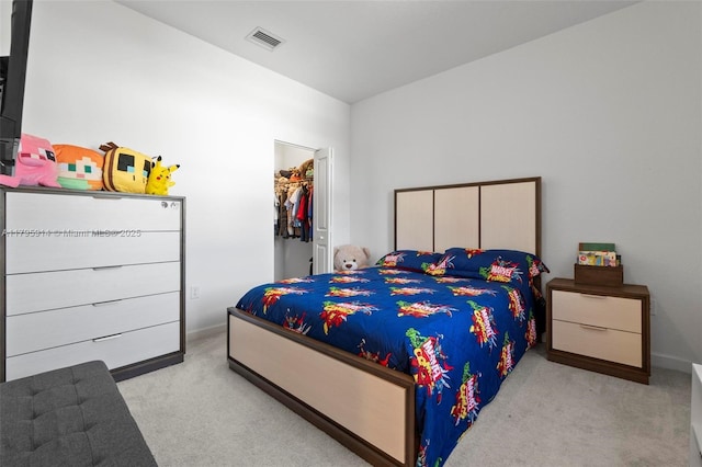 bedroom featuring carpet, a closet, visible vents, baseboards, and a spacious closet