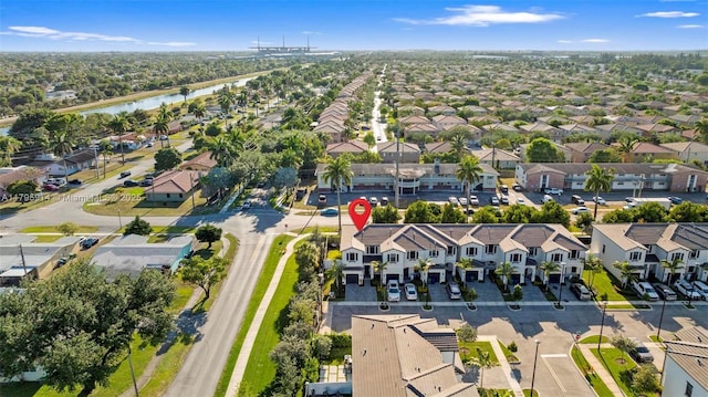 aerial view with a water view and a residential view