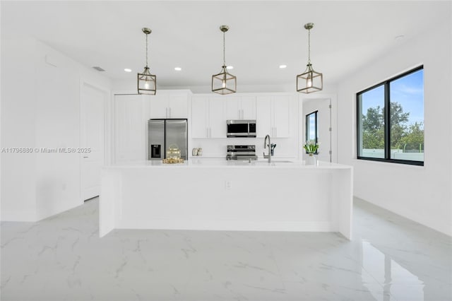 4115 20th St SW, Lehigh Acres, FL 33397 - kitchen with white cabinetry, a center island with sink, stainless steel appliances, and recessed lighting