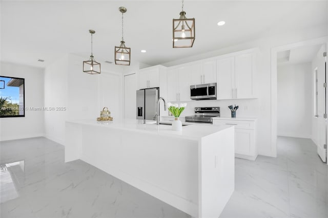 4115 20th St SW, Lehigh Acres, FL 33397 - kitchen featuring recessed lighting, marble finish floor, a sink, stainless steel appliances, and white cabinets