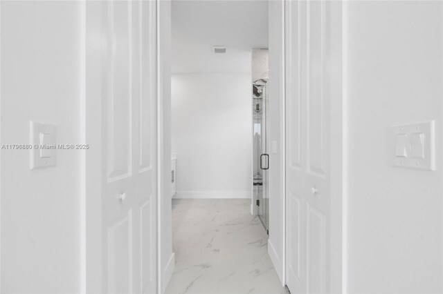 4115 20th St SW, Lehigh Acres, FL 33397 - hallway with baseboards, marble finish floor, and visible vents