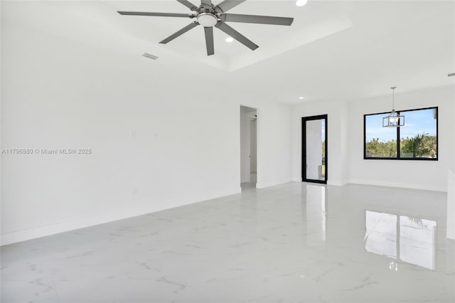4115 20th St SW, Lehigh Acres, FL 33397 - empty room with baseboards, marble finish floor, ceiling fan with notable chandelier, and recessed lighting