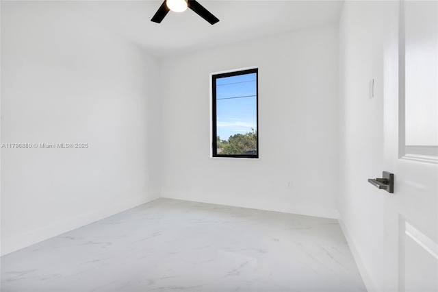 4115 20th St SW, Lehigh Acres, FL 33397 - unfurnished room featuring baseboards, a ceiling fan, and marble finish floor