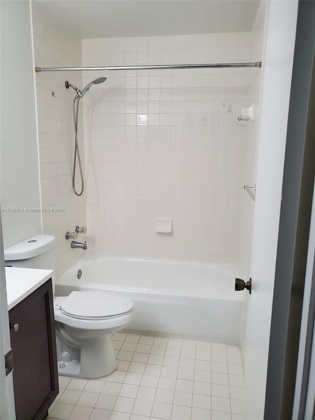 full bath with toilet, tile patterned flooring, vanity, and shower / tub combination