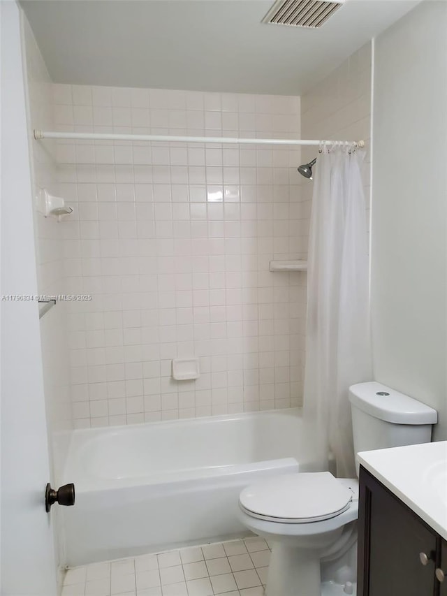 bathroom with toilet, vanity, visible vents, tile patterned flooring, and shower / bathtub combination with curtain