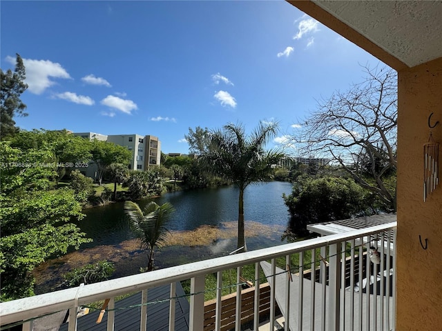 balcony featuring a water view
