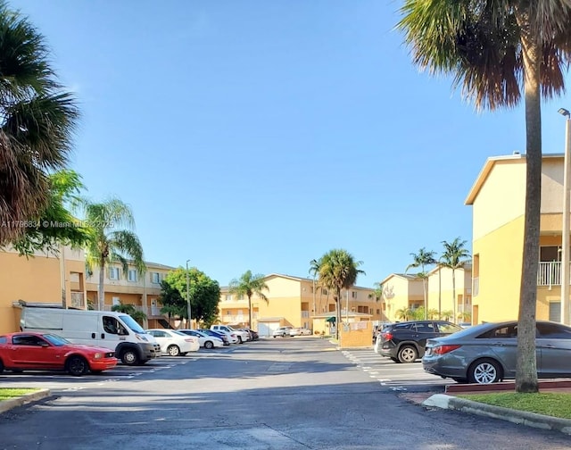 uncovered parking lot with a residential view