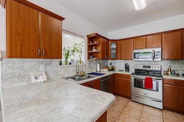 1110 Canella Ln, Hollywood, FL 33019 - kitchen featuring brown cabinets, light countertops, stainless steel appliances, and a sink