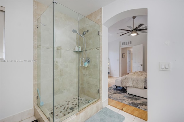 1110 Canella Ln, Hollywood, FL 33019 - ensuite bathroom featuring ensuite bath, visible vents, a stall shower, ceiling fan, and baseboards
