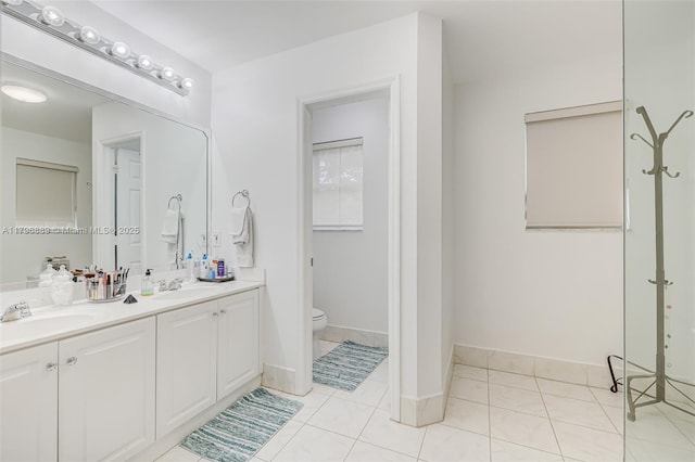 1110 Canella Ln, Hollywood, FL 33019 - full bathroom featuring double vanity, toilet, baseboards, and a sink