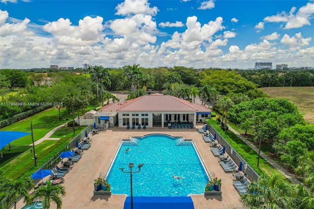 1110 Canella Ln, Hollywood, FL 33019 - community pool featuring a patio area and fence