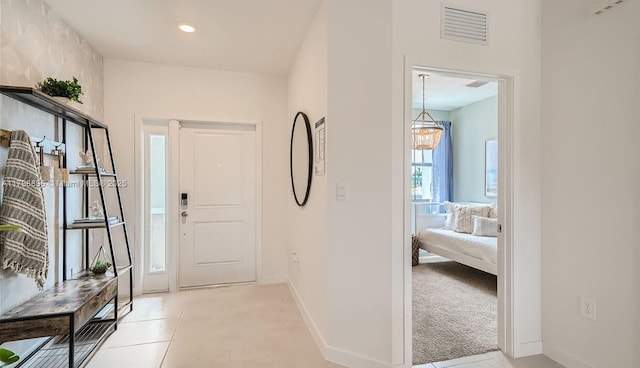 entrance foyer with light tile patterned floors, visible vents, baseboards, and recessed lighting