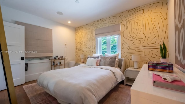 bedroom with wood finished floors and recessed lighting