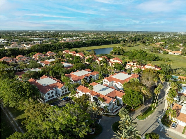 drone / aerial view featuring a water view and a residential view