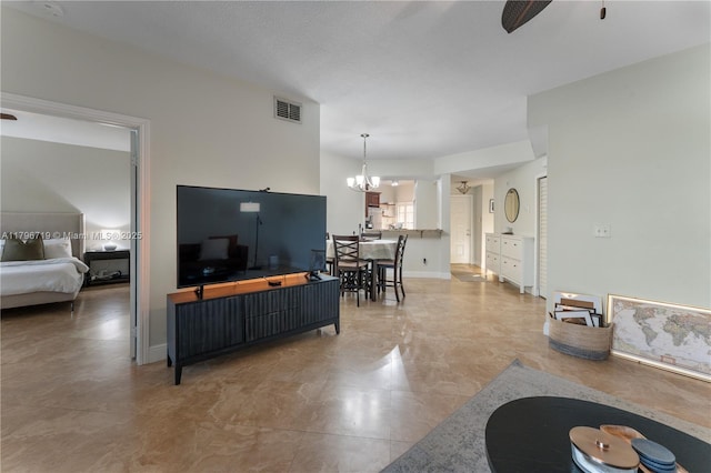 living room with visible vents and ceiling fan with notable chandelier