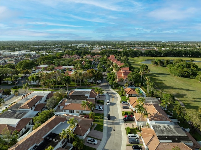 drone / aerial view with a water view and a residential view