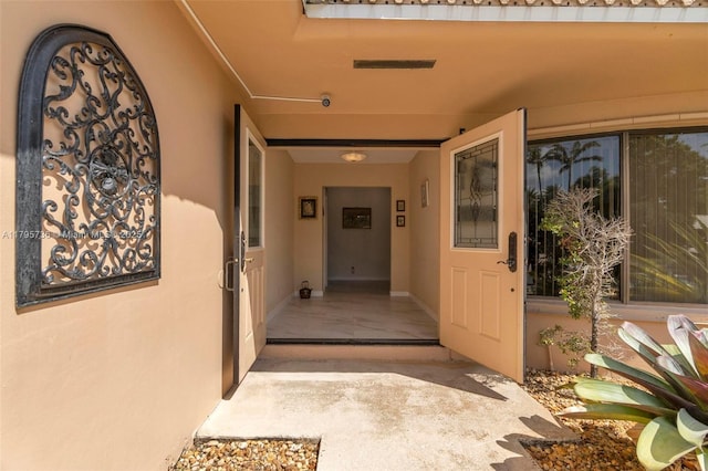 5101 N 37th St, Hollywood, FL 33021 - doorway to property with stucco siding and visible vents