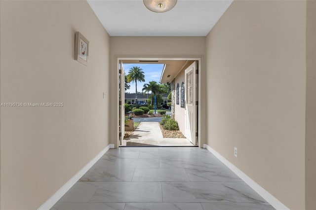 5101 N 37th St, Hollywood, FL 33021 - doorway to outside with marble finish floor and baseboards