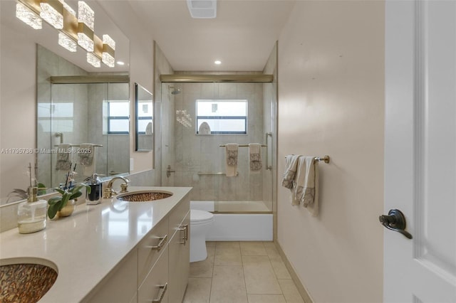 5101 N 37th St, Hollywood, FL 33021 - full bath with toilet, a sink, tile patterned floors, double vanity, and combined bath / shower with glass door