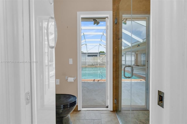 5101 N 37th St, Hollywood, FL 33021 - doorway to outside with a sunroom and tile patterned floors