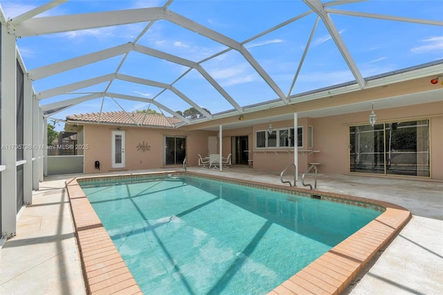5101 N 37th St, Hollywood, FL 33021 - rear view of property featuring a lanai, a patio, stucco siding, and an outdoor pool