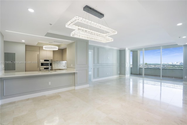 3400 SW 27th Ave Unit 1506, Miami, FL 33133 - unfurnished living room featuring an inviting chandelier, floor to ceiling windows, and recessed lighting