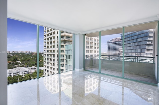 3400 SW 27th Ave Unit 1506, Miami, FL 33133 - empty room featuring baseboards, a city view, and floor to ceiling windows